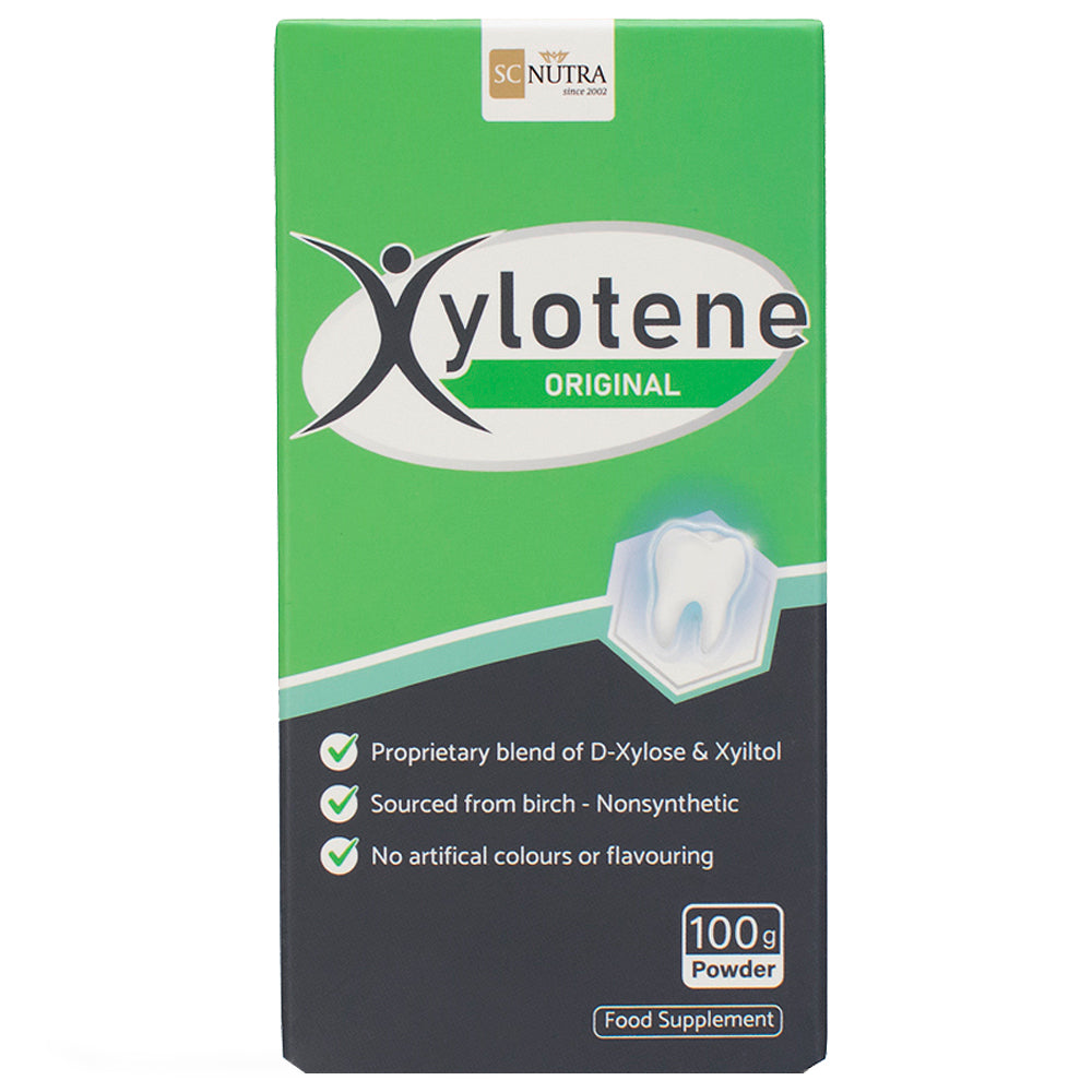 Xylotene Powder box front featuring a tooth with green and black colours.